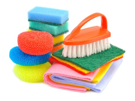 Cleaner making a bed and resetting a short-let property in Highbury